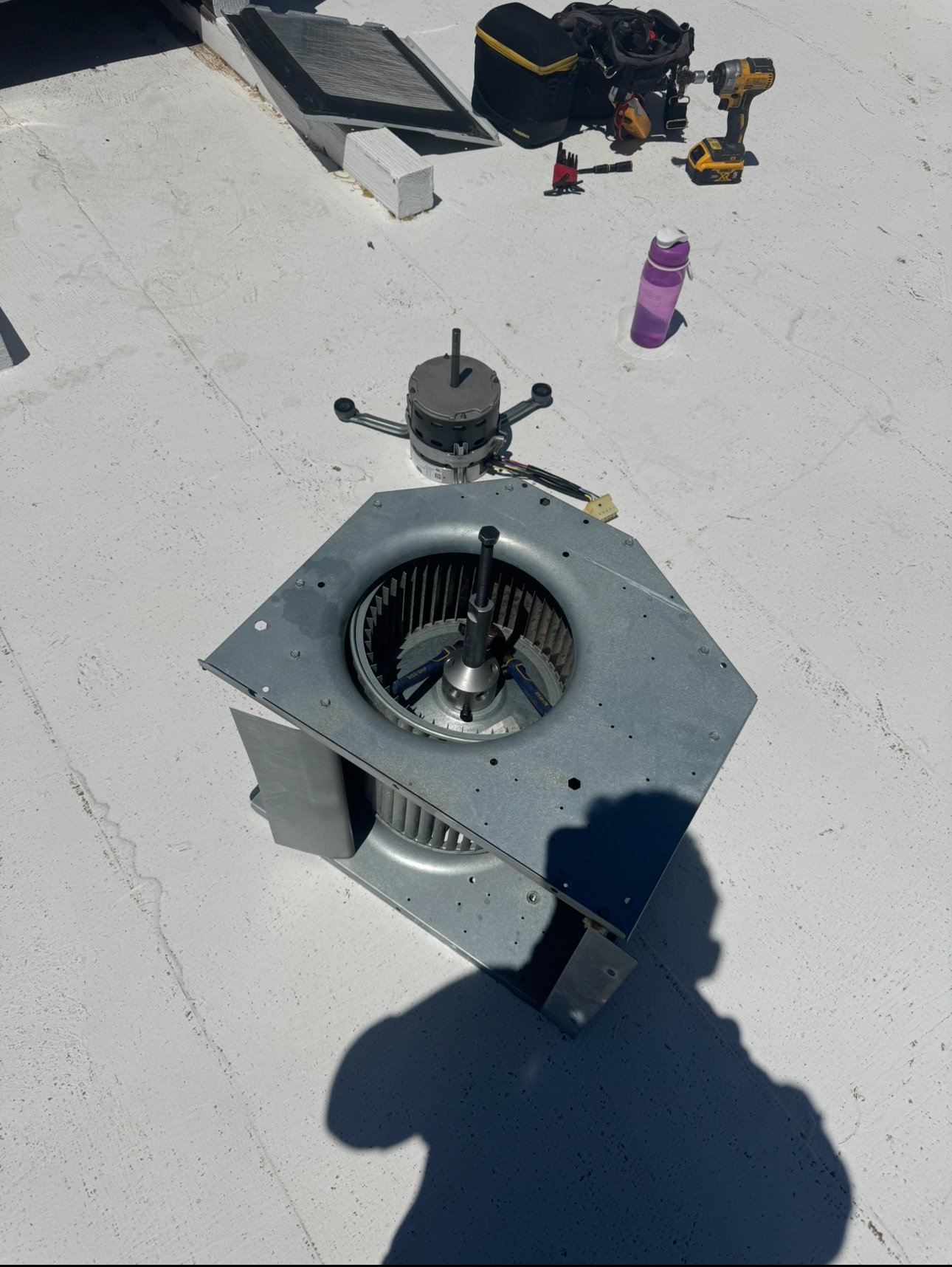 Blower motor being replaced in a residential AC system in Tucson