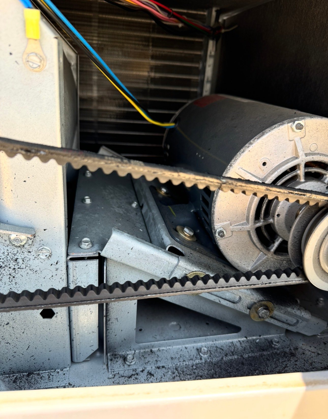 Worn belt in a commercial HVAC system in Tucson needing replacement