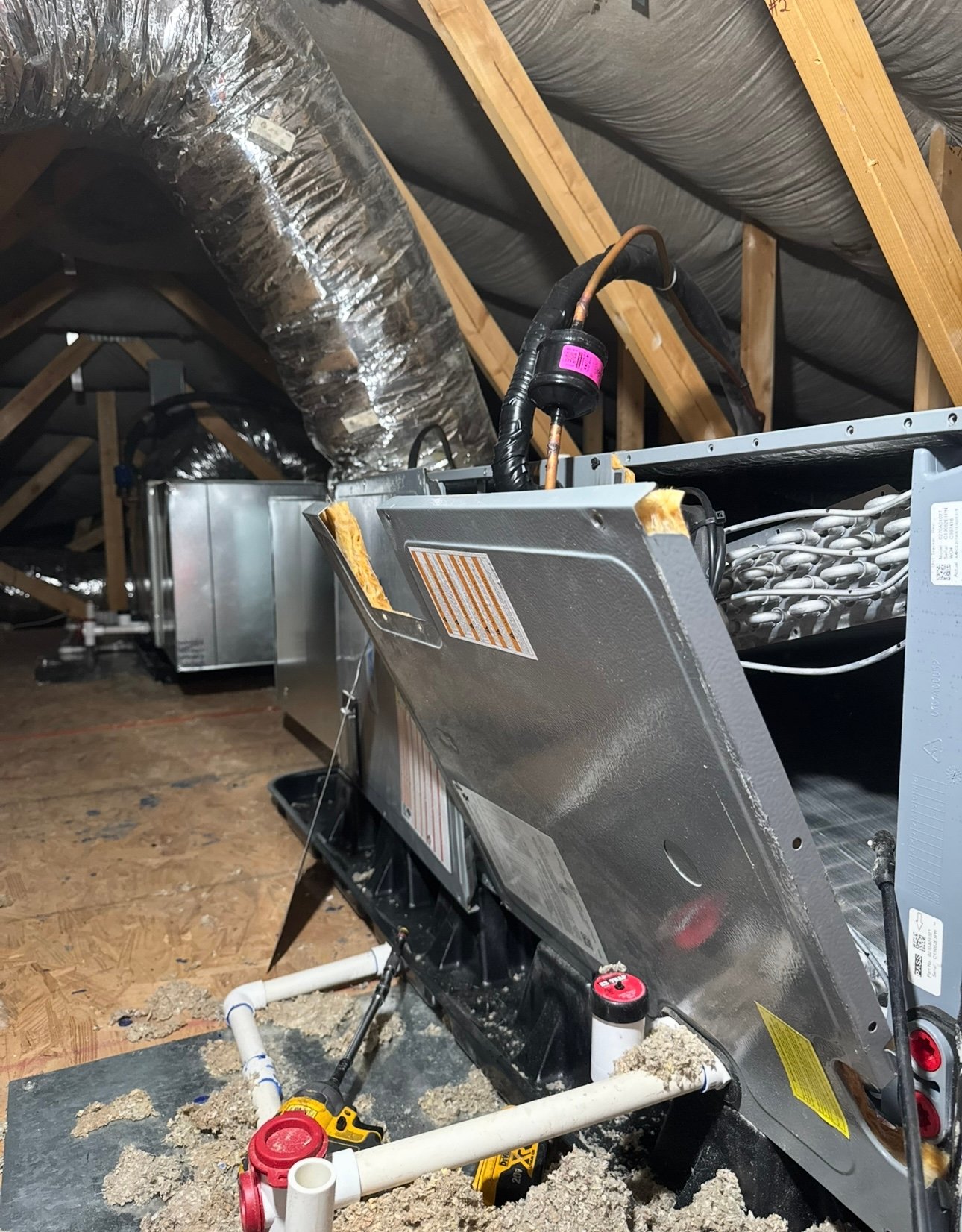 Open furnace in attic during residential HVAC maintenance in Tucson, AZ