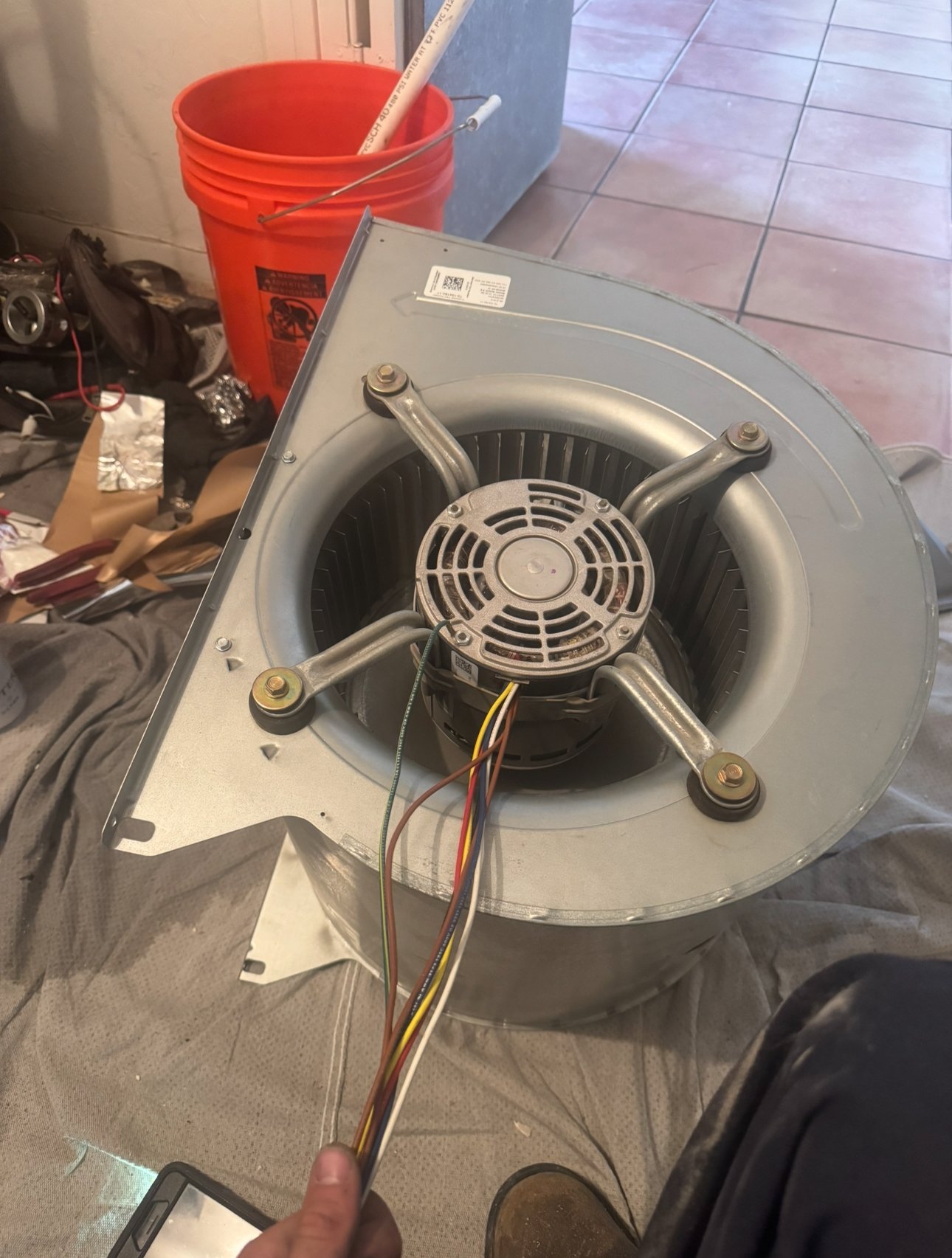 Blower motor and housing removed during AC maintenance in Tucson.