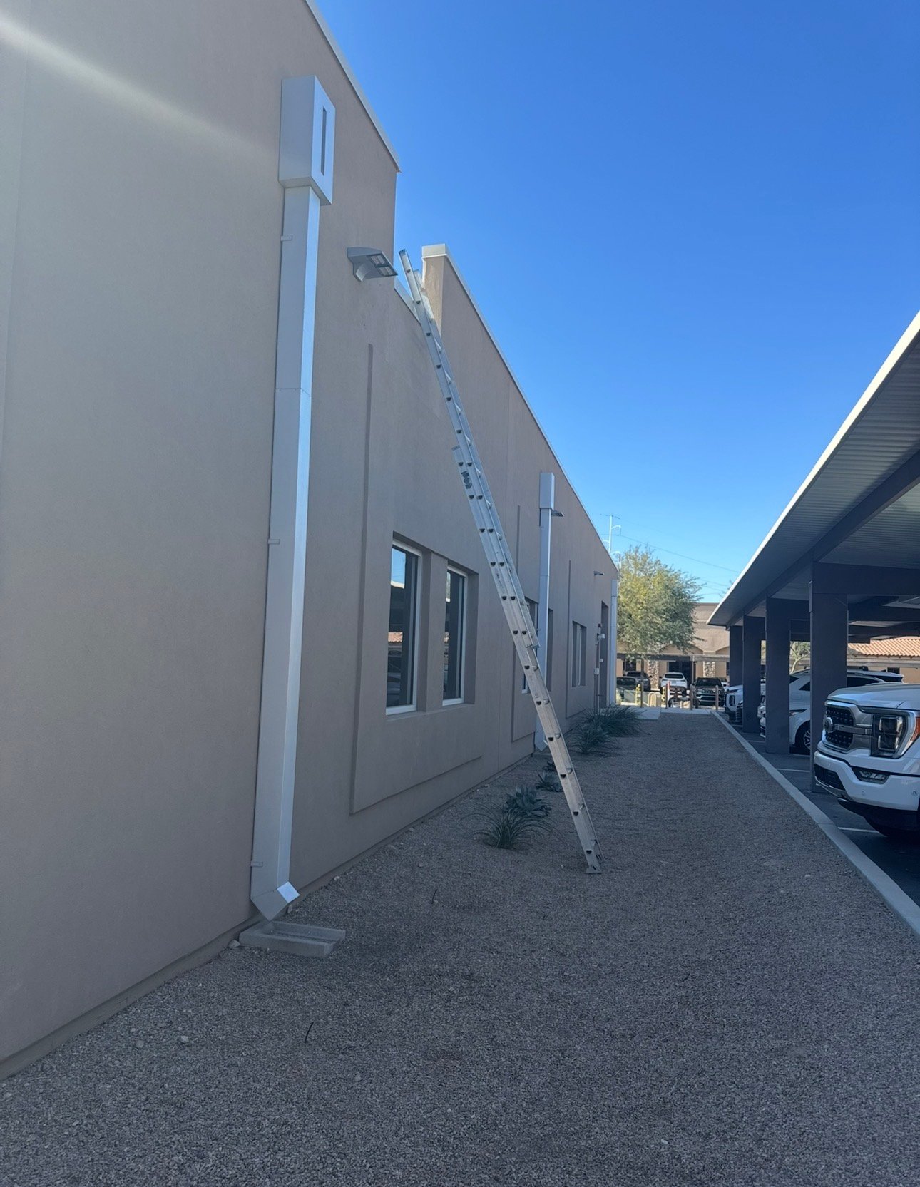 Ladder setup on roof for access to commercial HVAC unit