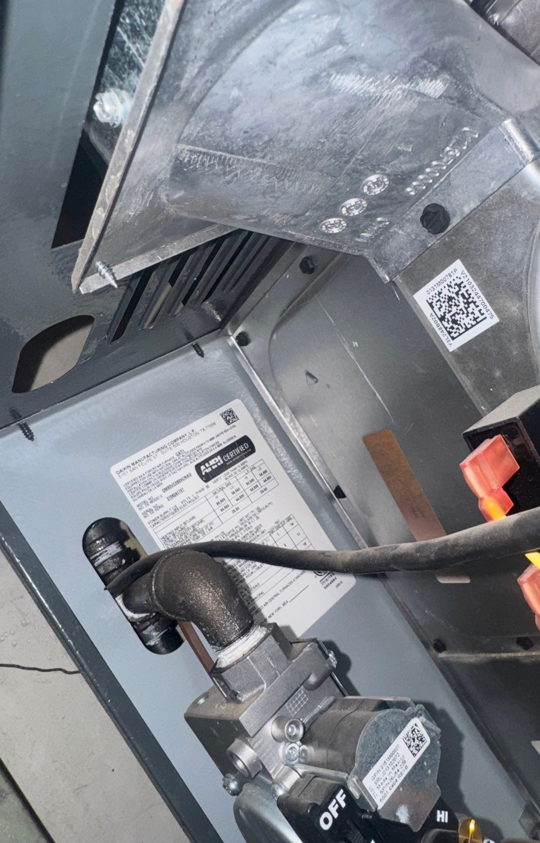 Data plate and gas valve on a residential furnace in Tucson