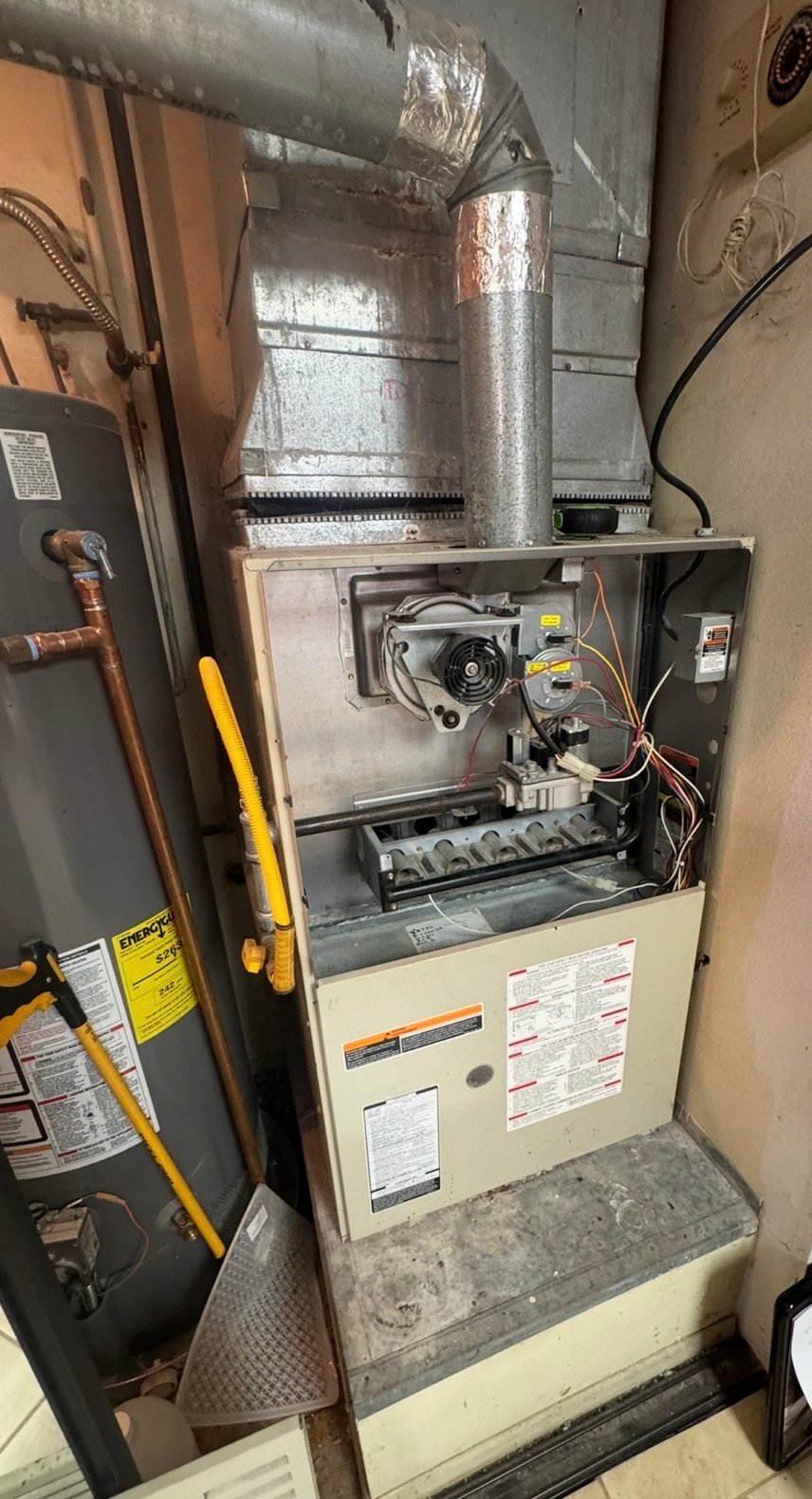 Older residential furnace requiring maintenance in Tucson