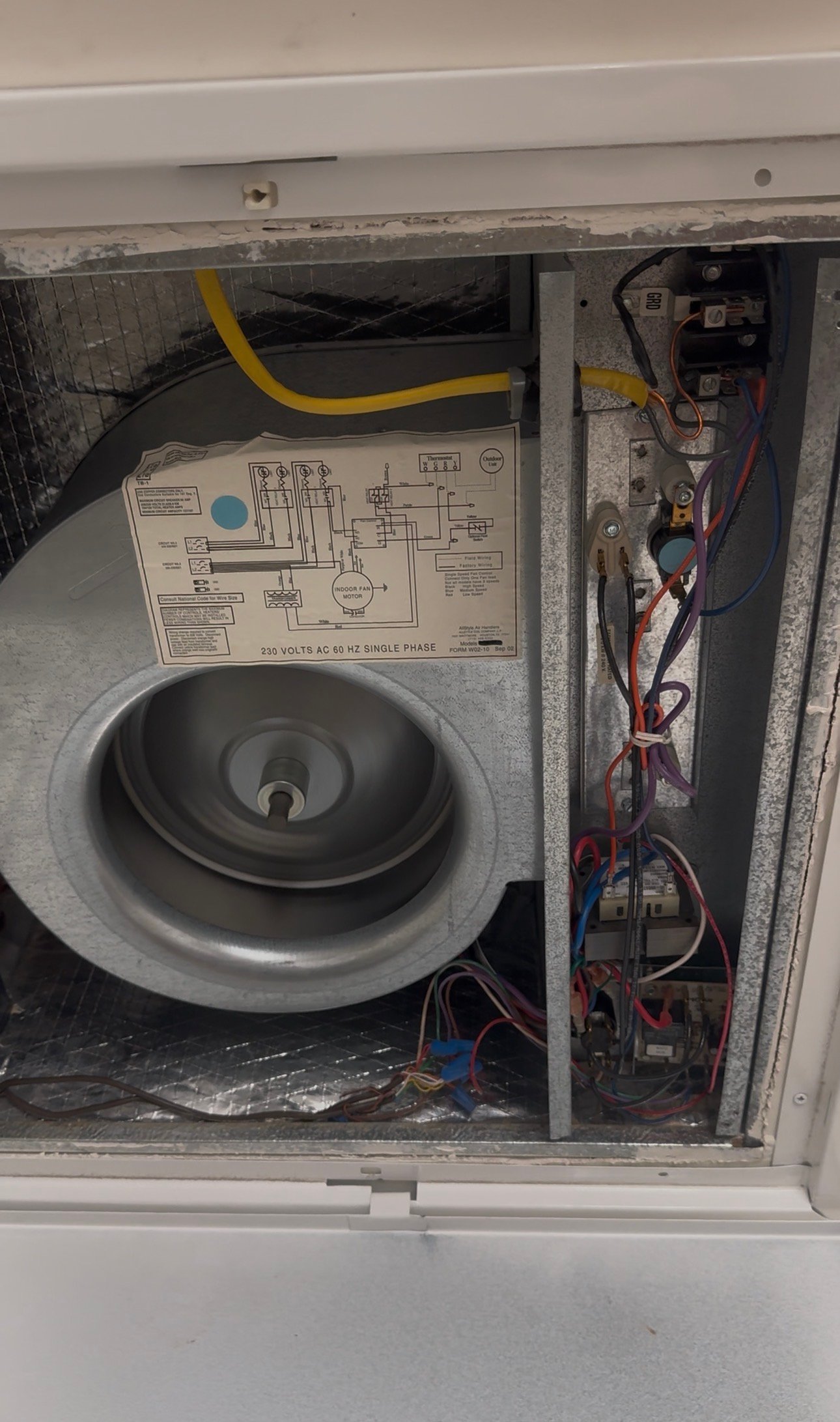 Opened electrical compartment showing blower motor during AC repair in SaddleBrooke, AZ