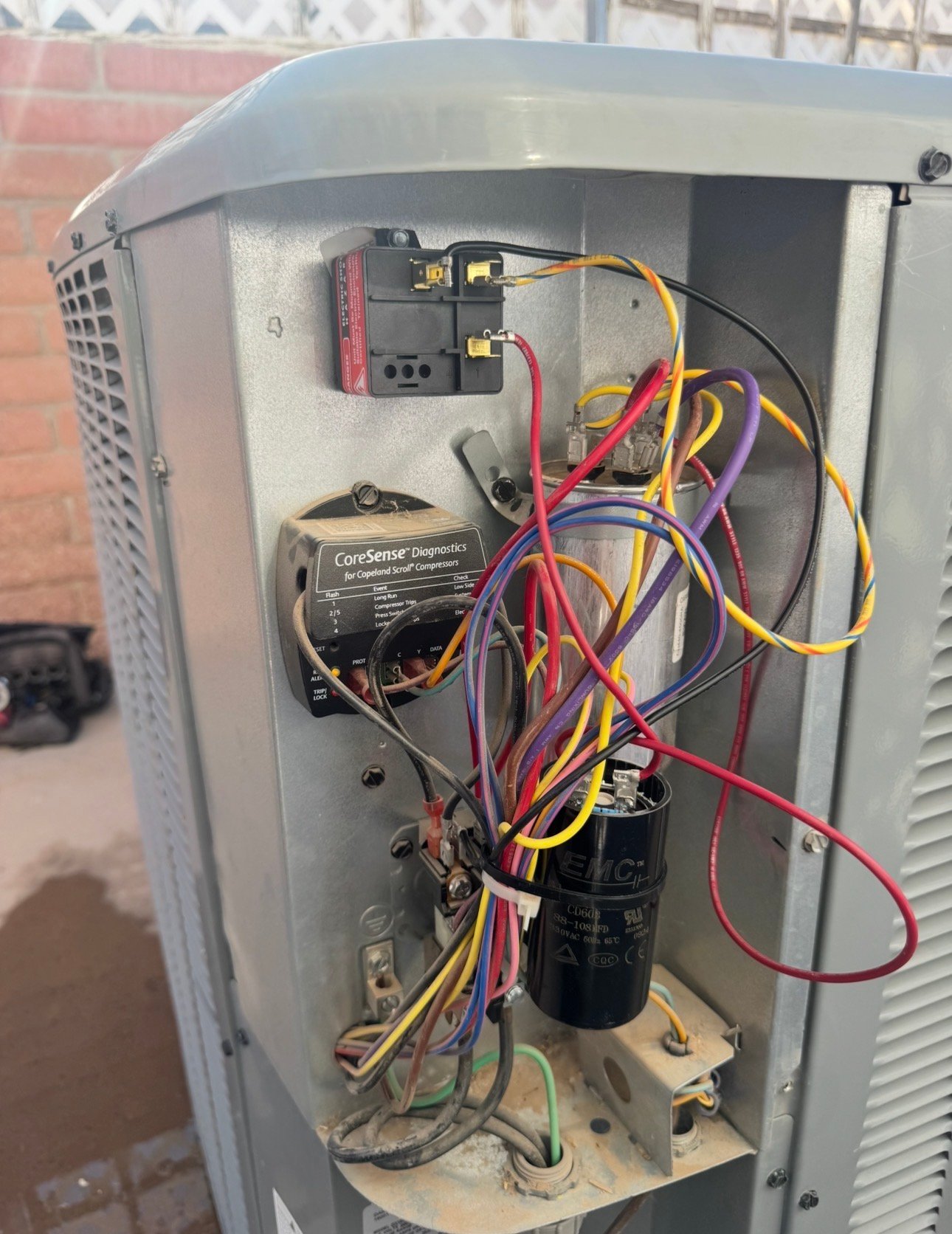 Capacitor and hard start kit inside an AC condenser in Vail, AZ