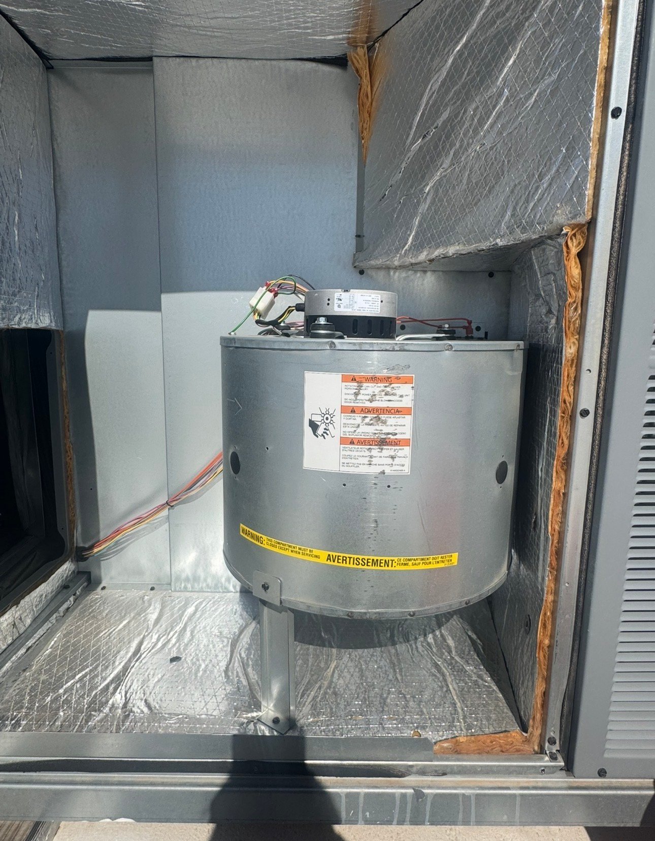 Indoor fan motor installed inside a package AC unit in Casas Adobes, AZ