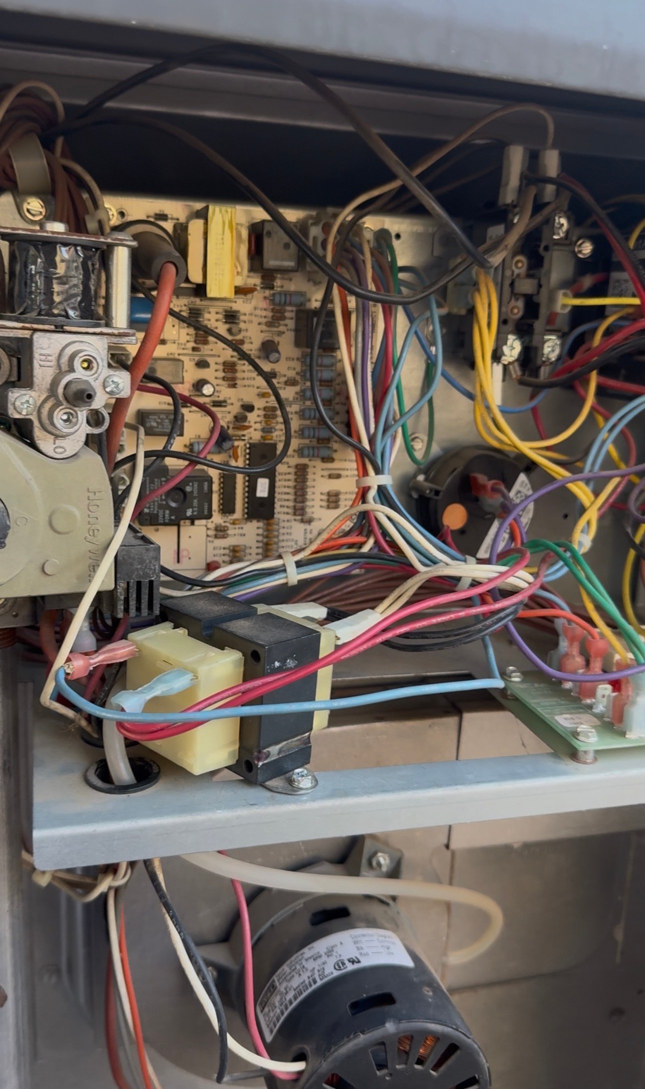 Control board inside a rooftop package AC unit during repair in Catalina, AZ