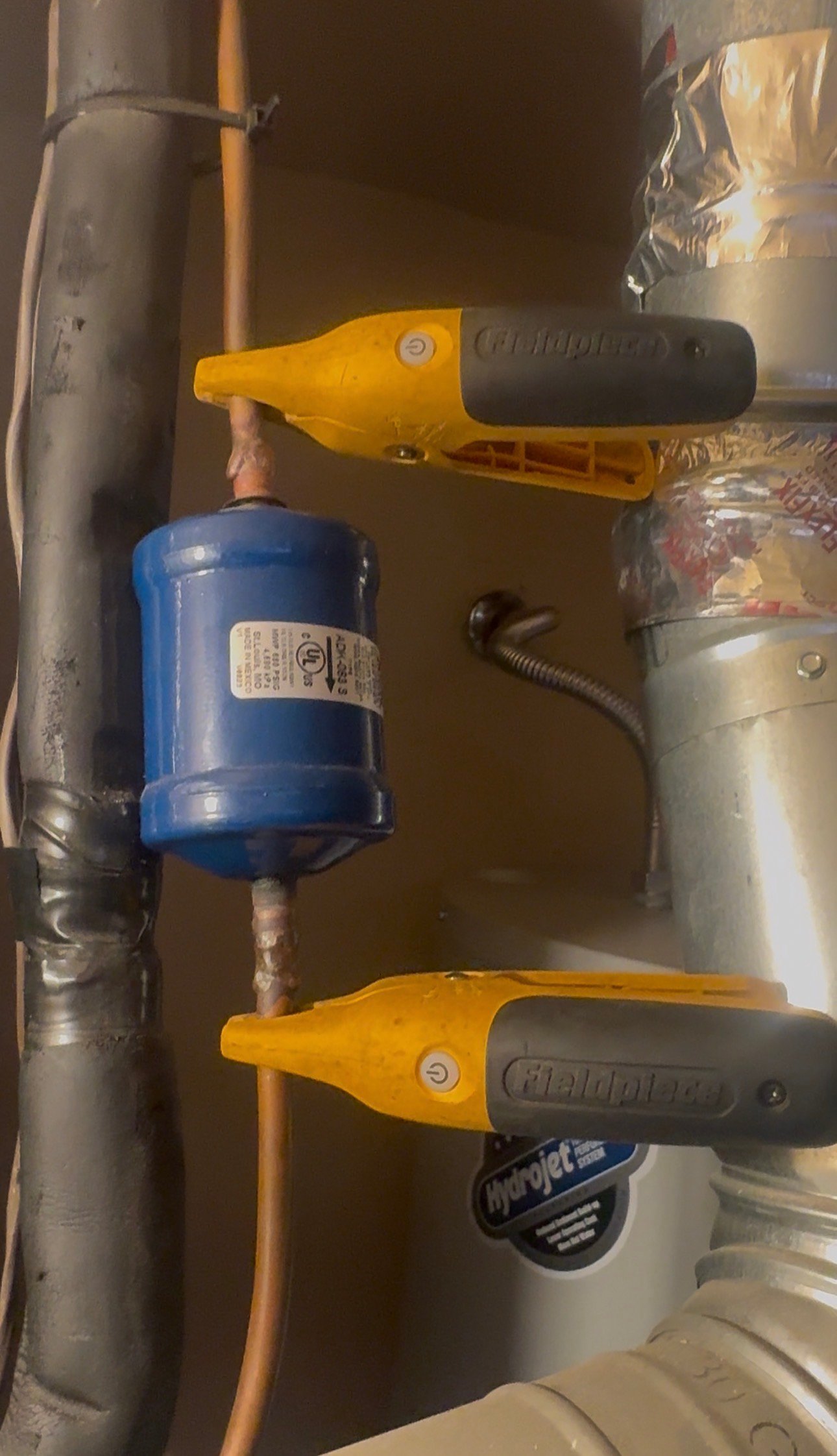 Liquid line filter drier in an AC system being inspected in Valencia West, AZ