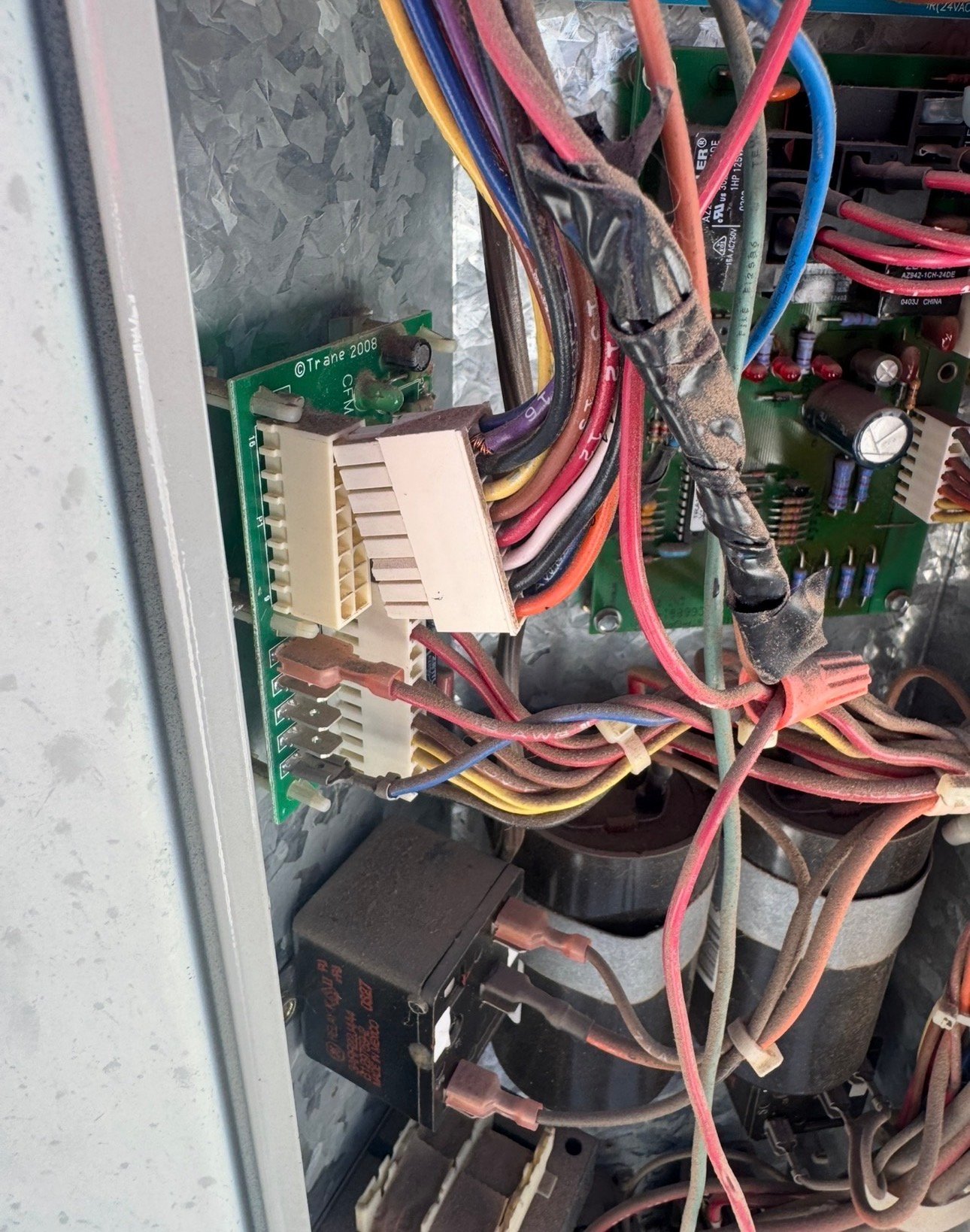 Control board disconnected for inspection during AC repair in Three Points, AZ