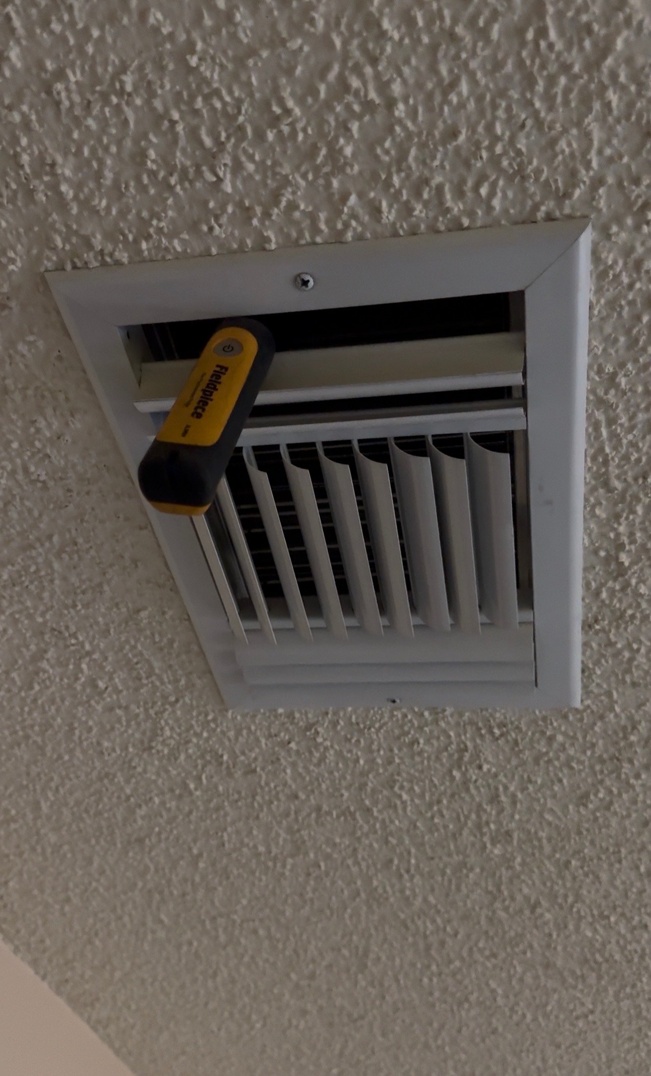 Supply vent delivering cool air during AC operation in Catalina Foothills, AZ