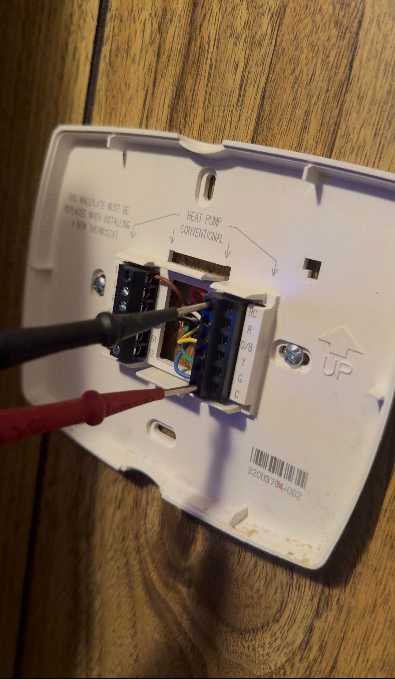Thermostat wiring leads connected to terminals during AC troubleshooting in Catalina Foothills, AZ