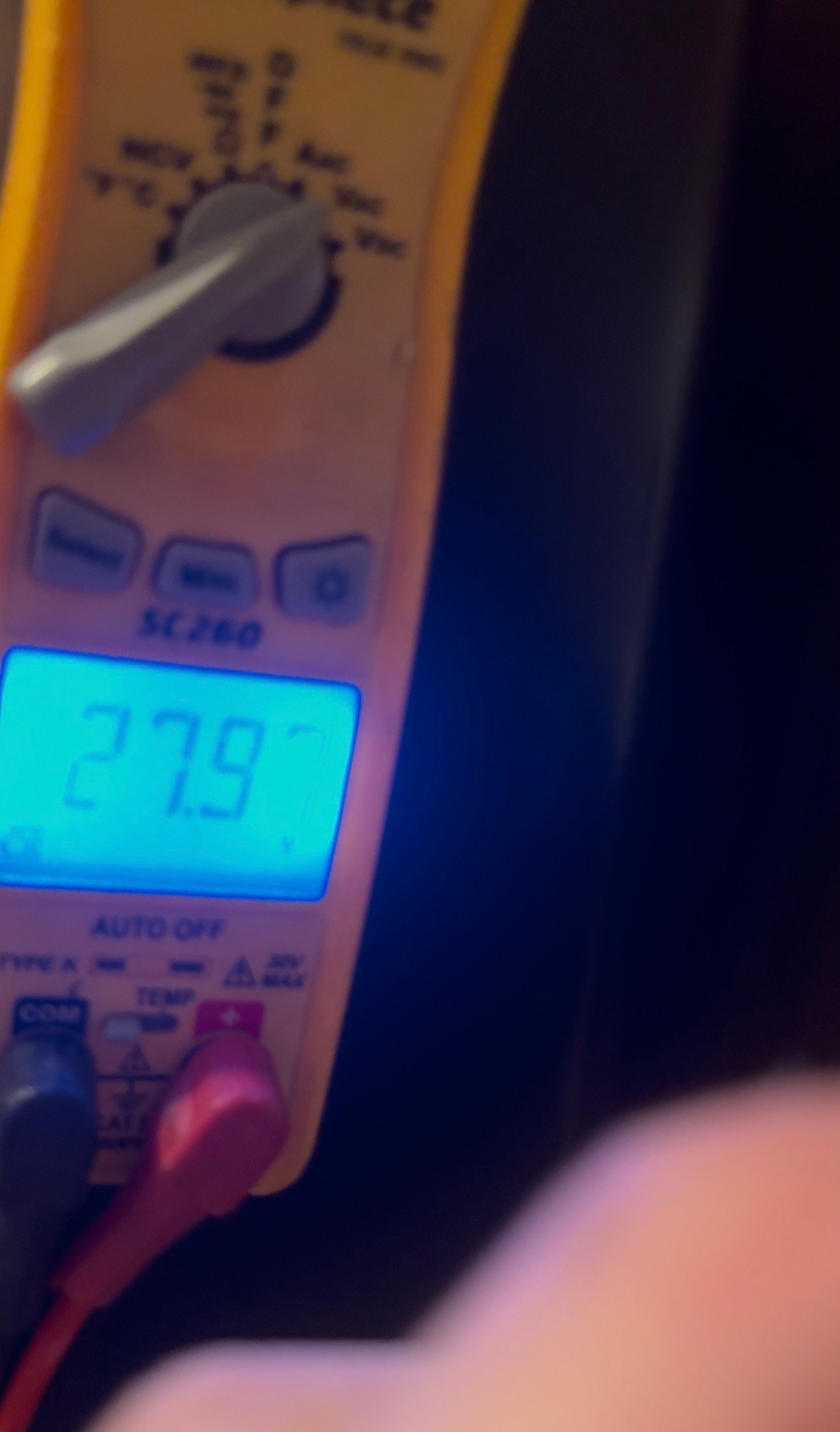 HVAC technician measuring 27 volt AC signal on a meter in Catalina Foothills, AZ